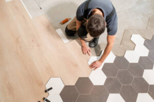 Worker of a flooring company in Jacksonville FL, doing his work.
